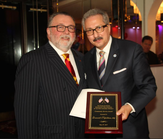 Domenick Napoletano (right) is presented with the Community Service Award by Joe Bova on behalf of the Stars and Stripes Regular Democratic Club. Eagle photo by Mario Belluomo