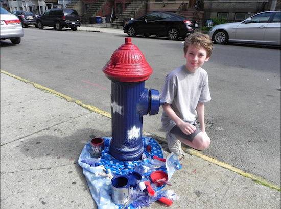 Nolan Keegan says he got the idea to paint fire hydrants when he thought about the sacrifices made by members of the military. Eagle photo by Paula Katinas