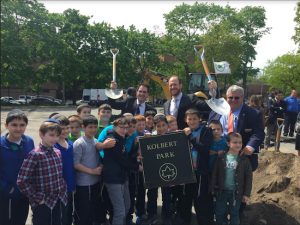Children from local schools helped the grownups celebrate the start of the reconstruction of Kolbert Park. Councilmember David Greenfield (center) secured $3.5 million for the project. Photo courtesy of Greenfield’s office