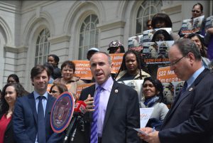 Councilmember Stephen Levin (left) is joining forces with several of his colleagues, including Councilmember Mark Treyger (at podium) to fight for funding for emergency food services. Photo courtesy of Levin’s office