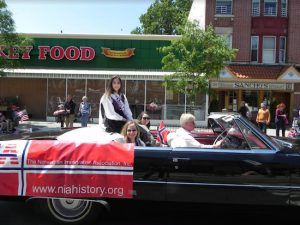 Sophie Feldman, who won the Miss Heritage title in the Miss Norway of Greater New York contest, enjoys riding the parade route. Eagle photos by Paula Katinas