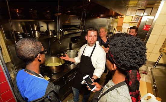 Chef Albert di Meglio demonstrates how to sauté for students in sauce making. Eagle photos by Andy Katz