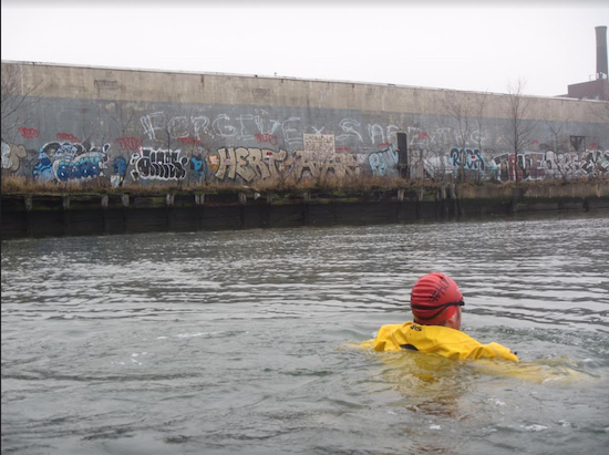 Clean water activist Christopher Swain swam the length of Newtown Creek in December 2015 to bring attention to the waterway’s toxic state. Photo courtesy of Christopher Swain