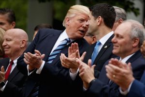 President Donald Trump smiles at Rep. Paul Ryan (R-Wis.) after the House pushed through a health care bill, in the Rose Garden of the White House on May 4, in Washington. AP Photo/Evan Vucci