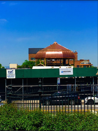 That's the Weir Greenhouse's new copper dome peeking over a construction fence. Eagle photo by Lore Croghan