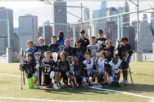 The Brooklyn Lacrosse Club’s U11 Select Team poses for a photo at Brooklyn Bridge Park’s Pier 6. Photos by Melina Mackall