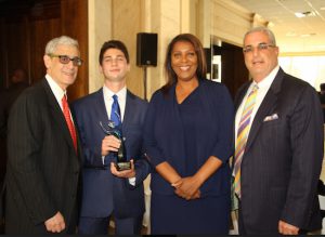 The Seneca Club of Brooklyn hosted its annual awards dinner where it honored more than 50 people and businesses including Maxwell Schwartz (second from the right), who created a political club at his high school. Pictured from left: Steve Cohn, Maxwell Schwartz, Public Advocate Letitia James and Steven Schwartz. Eagle photos by Mario Belluomo