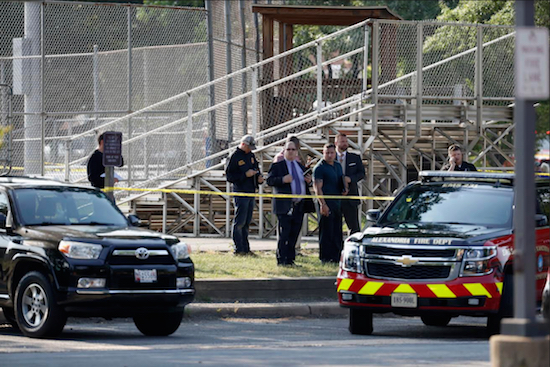 Law enforcement officers investigate the scene of a shooting near a baseball field in Alexandria, Va., Wednesday, where House Majority Whip Steve Scalise of La. was shot at a Congressional baseball practice. AP Photo/Alex Brandon