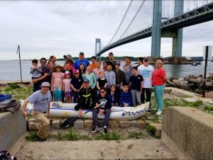 Tom Greene (kneeling, left) brings a group of volunteers down to Denyse Wharf for a cleanup campaign twice a year. Photos courtesy of Greene