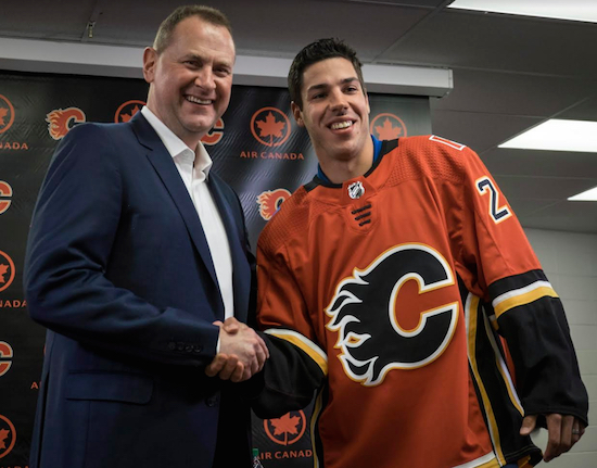 Travis Hamonic was introduced as a member of the Calgary Flames on Monday, donning his new No. 24 jersey. He wore No. 3 here for the Islanders. AP Photo by Jeff McIntosh