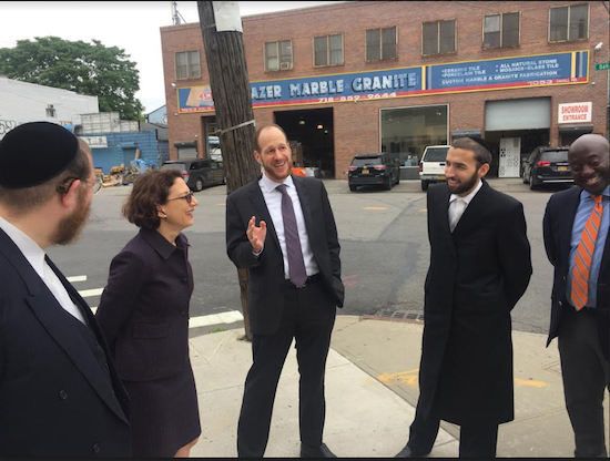 DOT Commissioner Polly Trottenberg and Councilmember David Greenfield chat with local officials during the inspection tour of traffic trouble spots in Borough Park and Flatbush. Photo courtesy of Greenfield’s office