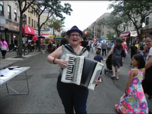 Accordion player Ellen Lindstrom was along many street musicians who entertained pedestrians at the 2016 Summer Stroll. Eagle file photo by Paula Katinas