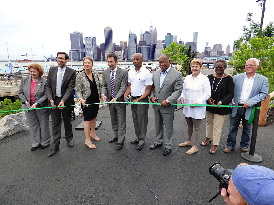 Officials cut the ribbon (from left): Assemblymember Jo Anne Simon, state Sen. Daniel Squadron, Deputy Mayor Alicia Glen, BBP President Eric Landau, Borough President Eric Adams, NYC Parks Commissioner Mitchell Silver, and Brooklyn Bridge Park members Joanne Witty, Edna Wells Handy and William Vinicombe. Photos by Mary Frost