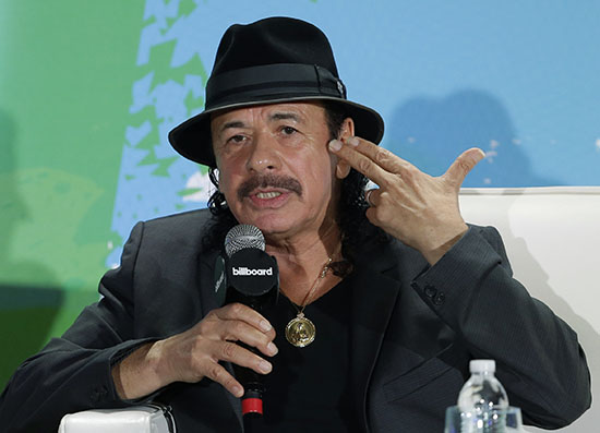Musician Carlos Santana celebrates his birthday today. AP Photo/Wilfredo Lee