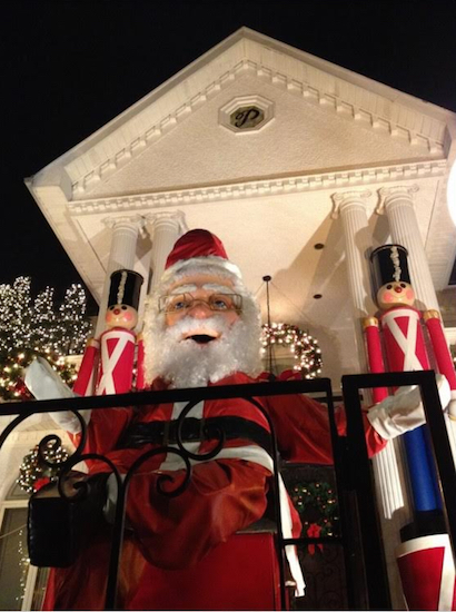 Tourists flock to Dyker Heights every year to take in the delightful Christmas displays, like this giant Santa Claus, that homeowners install outside their houses. Eagle file photo by Lore Croghan