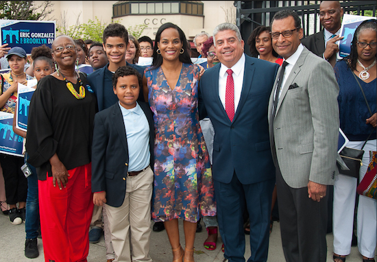 Acting DA Eric Gonzalez (second from right) poses with Bertha Lewis (left), the Rev. A.R. Bernard (left) and their families after the duo announced they were supporting Gonzalez in the Brooklyn DA’s race. Photo by Kevin Pratt for Eric Gonzalez for District Attorney