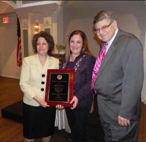 Laurie Windsor (center) shown here receiving the Ronald Reagan Americanism Award from Brooklyn Conservative Party leaders Fran Vella Marrone and Jerry Kassar in 2014, says she will still be active in the community. Eagle file photo by Paula Katinas