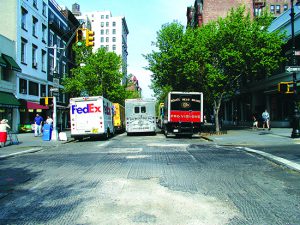 Trucks side by side on Montague Street in Brooklyn. Eagle file photo