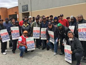 Electrical Workers Local Union No. 3 members picket in front of the Spectrum (Time Warner Cable) building in Sunset Park. Eagle photo by John Alexander