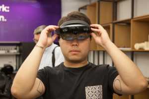 A student demonstrates virtual reality goggles at a demonstration at NYU Tandon. Photo courtesy of NYU Tandon
