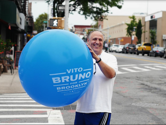 Brooklyn Borough President candidate Vito Bruno holds a campaign balloon outside Delia’s Lounge in Bay Ridge. Eagle photos by Arthur De Gaeta