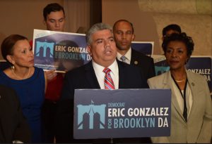 Eric Gonzalez (at podium) gained the endorsements from local Democratic Congress members because they believe that he will help in the fight against President Donald Trump’s policies. From left: U.S. Reps. Nydia Velázquez, Hakeem Jeffries and Yvette Clark. Eagle photos by Rob Abruzzese