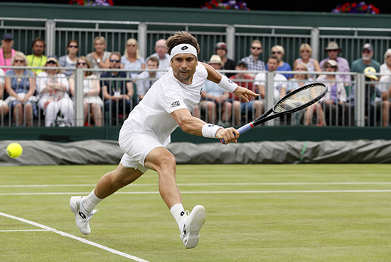 Spain's David Ferrer runs for the ball during their Men's Singles Match on day two at the Wimbledon Tennis Championships in London on July 4, 2017. AP Photo/Kirsty Wigglesworth