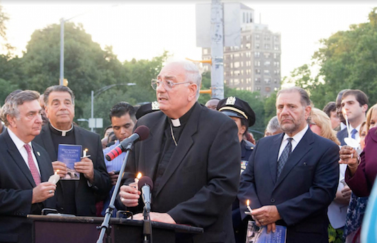 Bishop Nicholas DiMarzio speaks during a 2016 interfaith rally at Grand Army Plaza. Standing with him are Rabbi Joseph Potasnik of the New York Board of Rabbis, and Msgr. David Cassato. Rabbi Potasnik is one of the signers of Gov. Cuomo’s just-released statement against hatred. Eagle file photo by Francesca N. Tate