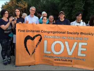 Members of First Unitarian Church are pictured at a July 11, 2016 prayer vigil brought more than a thousand Brooklynites and others around the metropolitan area to Grand Army Plaza for a rally hosted by Brooklyn Borough President Eric Adams. First Unitarian Church will participate in an interfaith gathering on Tuesday. Eagle photo by Francesca N. Tate