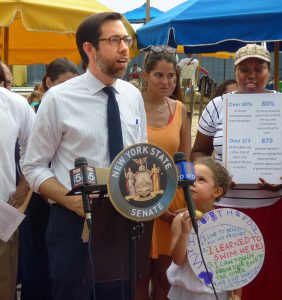 The question of who will be replacing state Sen. Daniel Squadron after he steps down is raising concerns. Shown: Squadron during last summer’s push to keep the Pop-Up Pool in Brooklyn Bridge Park open. Photo by Mary Frost