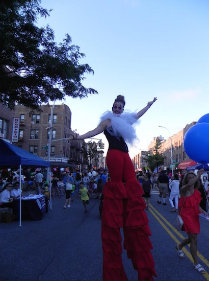 An acrobat walking on stilts had a grand time greeting visitors to the Summer Stroll on 3rd Friday night. Eagle photos by Paula Katinas