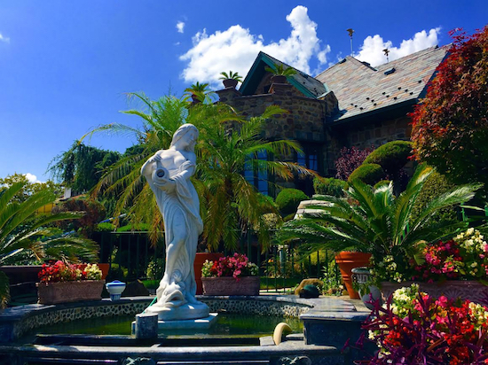 Dyker Heights is in its full late summer splendor, as we can see with this waterfall and statue at 8302 11th Ave., reminiscent of a Mediterranean villa. Eagle photos by Lore Croghan