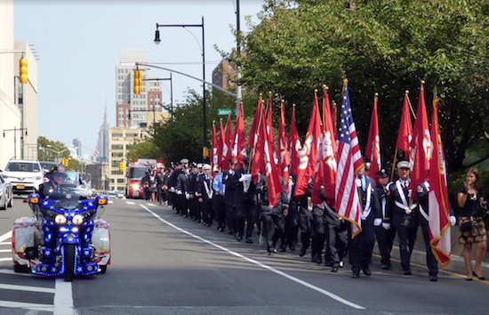Accompanied by ceremonial motorcycles broadcasting “Amazing Grace,” firefighters from across the country marched through Downtown Brooklyn on Monday to remember Brooklyn’s FDNY members and all who lost their lives on Sept. 11, 2001. Eagle photos by Mary Frost