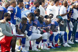 In this photo taken on Sunday, Sept. 24, Buffalo Bills players take a knee during the playing of the national anthem prior to an NFL football game against the Denver Broncos in Orchard Park, N.Y. AP Photo/Jeffrey T. Barnes, File
