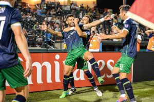 Cosmos players celebrate their first goal of the game. New York’s exultation, however, was short-lived after the team conceded two goals in the final 11 minutes of the match, despite having a man advantage. Photos courtesy of the New York Cosmos