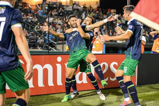 Cosmos players celebrate their first goal of the game. New York’s exultation, however, was short-lived after the team conceded two goals in the final 11 minutes of the match, despite having a man advantage. Photos courtesy of the New York Cosmos