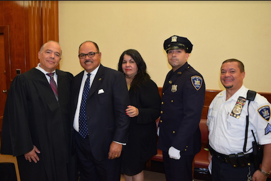 The Cervantes Society kicked off Brooklyn's Hispanic Heritage Month celebration in the Brooklyn courts on Tuesday. Pictured from left: Hon. Francois Rivera, Hector Batista, Major Luz Bryan, Court Officer Edwin Colon and Court Sergeant Michael Garcia. Eagle photos by Rob Abruzzese