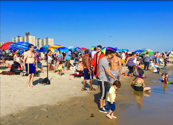 Coney Island’s beach is busy, busy, busy on Labor Day. Eagle photos by Lore Croghan