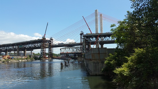 The main span of the old Kosciuszko Bridge was lowered and barged out of New York in July. Its remaining pieces have yet to be demolished. Eagle file photo by Liliana Bernal