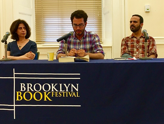 Jonathan Safran Foer reads from his novel “Here I Am” at the Brooklyn Book Festival. That's novelist Fernanda Torres at left and novelist Rodrigo Hasbun at right. Eagle photo by Lore Croghan
