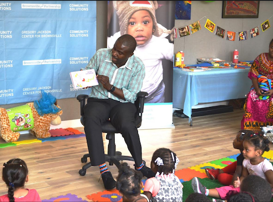 Program Director Keston Jones reads aloud to children at SCO’s “Brownsville Reads” celebration. Photos courtesy of SCO Family of Services