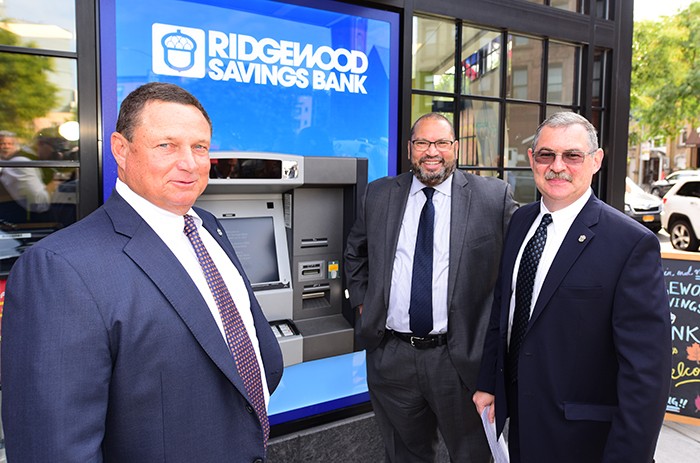 From left: Ridgewood Bank Executive Peter Boger, Carlos Sanchez and Leonard Stekol at the Clinton Hill branch grand opening.