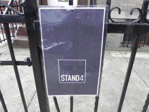 A sign on the gate outside 414 78th St. in Bay Ridge announces the arrival of Stand4, a new art gallery. Eagle photo by Paula Katinas