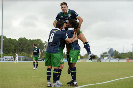 Cosmos players celebrate a goal on Sunday in Jacksonville, Florida. New York overcame a two-goal deficit to earn a crucial point in the playoff race. Photos courtesy of Jacksonville Armada FC