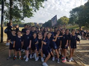 Having reached their destination in Shore Road Park, students from St. Anselm Catholic Academy celebrate. Photo courtesy of John Quaglione