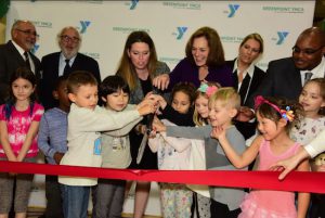 YMCA of Greenpoint daycare program kids prepare to cut the ribbon with help from Marian Klein and Sharon Greenberger. Eagle photos by Andy Katz