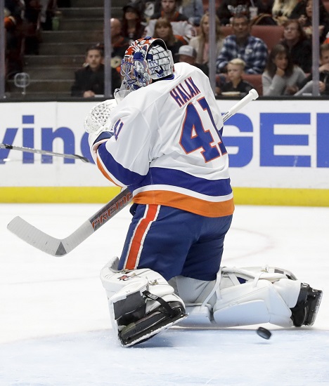 Islanders goalie Jaroslav Halak can’t stop this puck from slithering through his legs and into the net during the second period of the Brooklyn-based NHL franchise’s 3-2 loss in Anaheim on Wednesday night. AP Photo by Chris Carlson