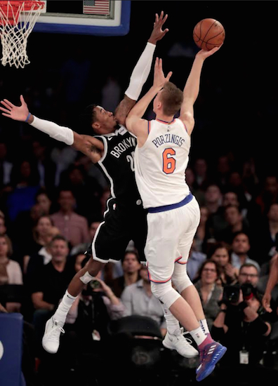 Rondae Hollis-Jefferson gets in Kristaps Porzingis’ face during the Nets’ 115-107 victory over the Knicks at Madison Square Garden on Tuesday night. AP Photo by Julie Jacobson