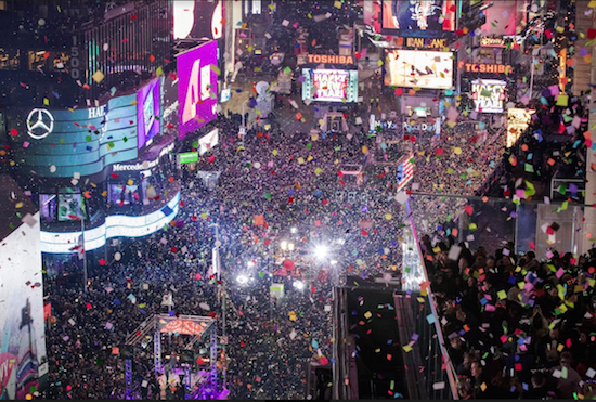Revelers celebrate the New Year as confetti flies over Times Square as seen from the Marriott Marquis on Jan. 1. Under a House bill sponsored by Brooklyn’s Dan Donovan and Manhattan’s Adriano Espaillat, cities would get federal funds to install pedestrian safety measures in heavy trafficked areas like Times Square. AP Photo/Mary Altaffer