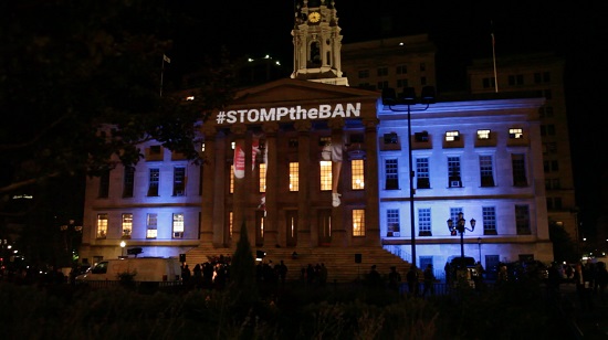 Brooklyn Borough Hall was decorated with a #StomptheBan projection, showing resistance to President Trump’s third travel ban. Eagle photo by Liliana Bernal